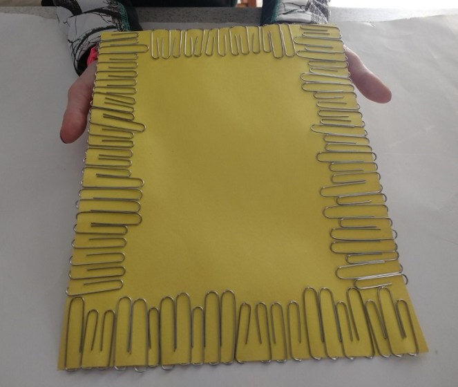 paperclips around paper fine motor activity